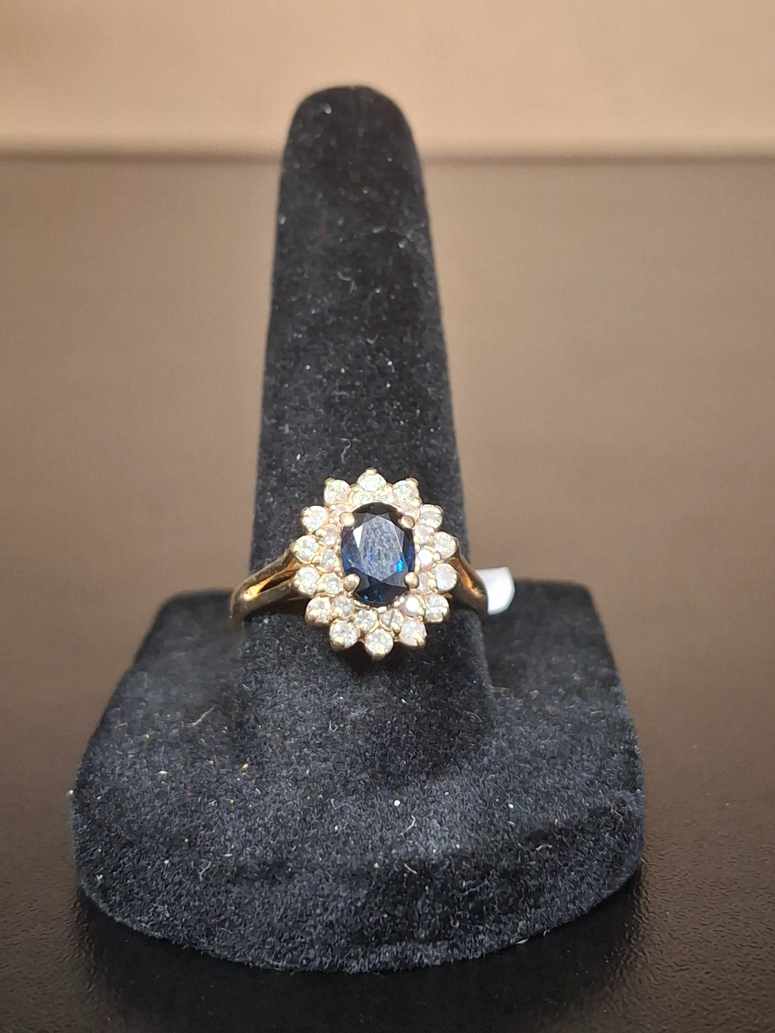 LADY'S STONE & DIAMOND RING: 2.49DWT 14K-Y/G, 1-OVAL CUT SAPPHIRE 0.57CTW, 28-ROUND BRILLIANT CUT DIAMOND 0.28CTW