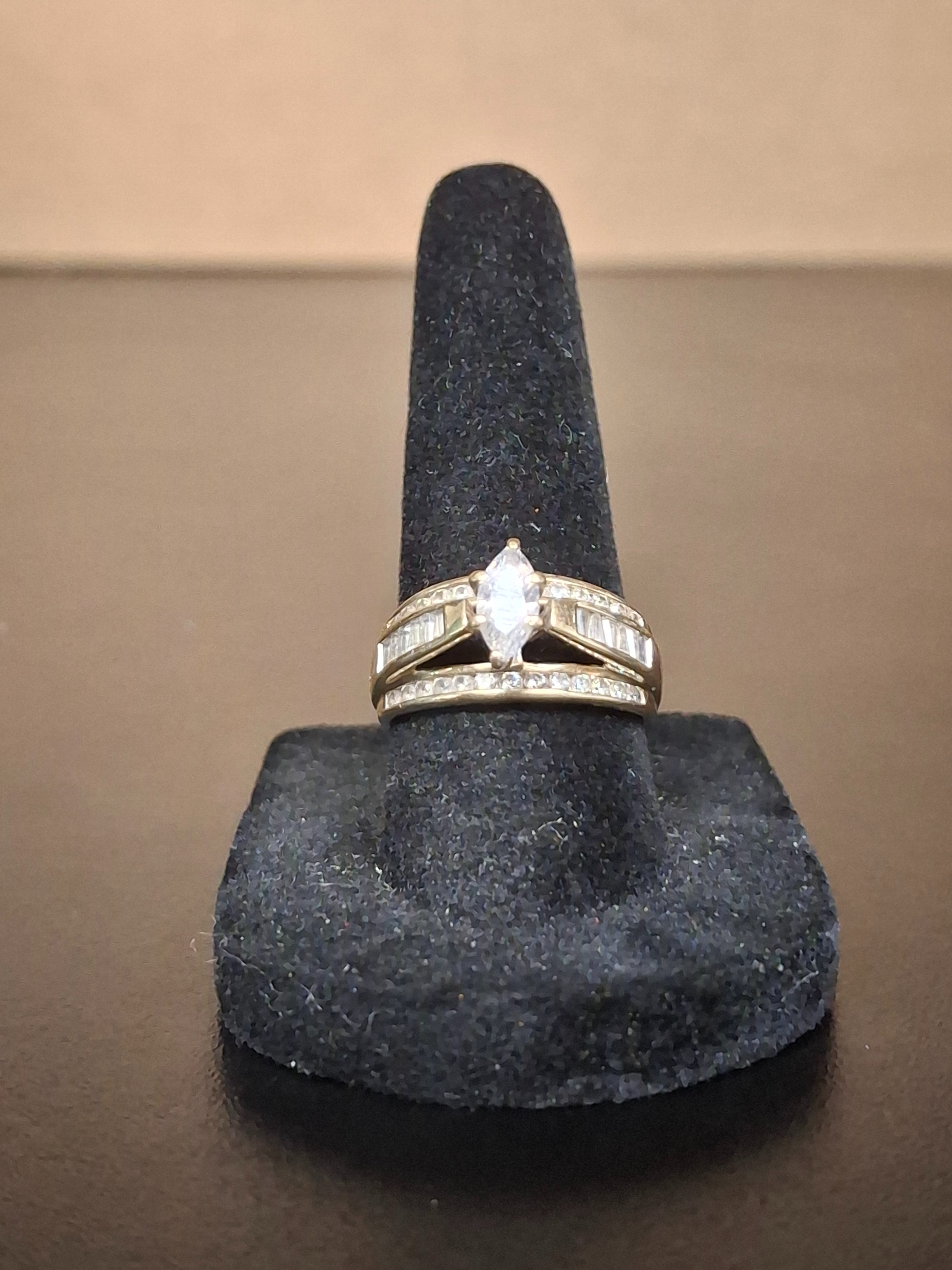 LADY'S DIAMOND SOLITAIRE RING: 2.4DWT 10K-Y/G, 1-ROUND BRILLIANT CUT DIAMOND 0.01CTW, LADIES MARQUISE CUT SOLITARE