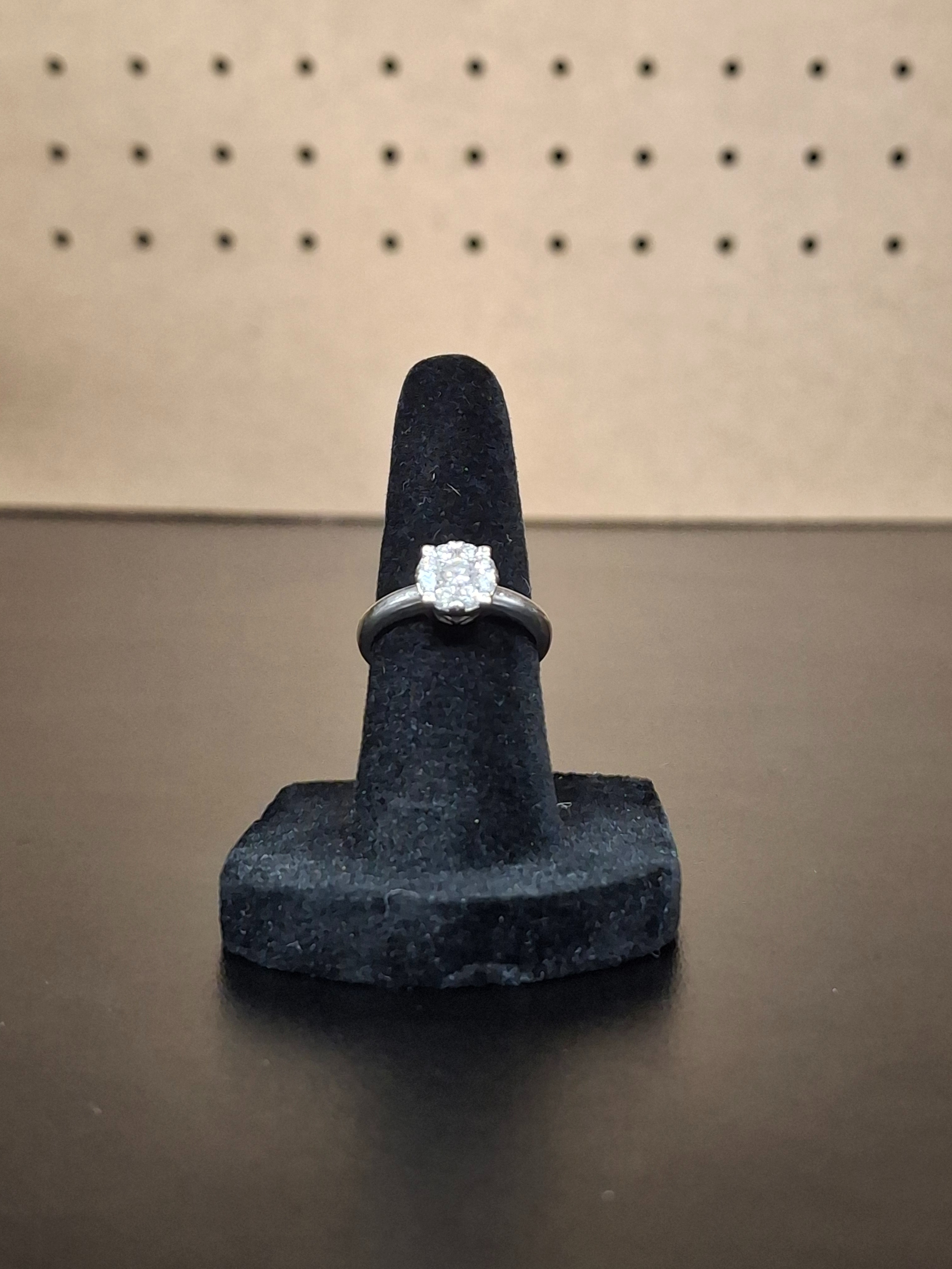 LADY'S DIAMOND SOLITAIRE RING: 2DWT 10K-W/G, 14-ROUND BRILLIANT CUT DIAMOND 0.14CTW, QUADRATIARE WHITE STONE RING WITH CHIPS IN HEAARTS BAND SETTING